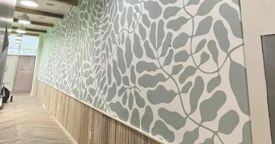 Dimensional signage set against custom wallpaper inside the Chick Me Out restaurant